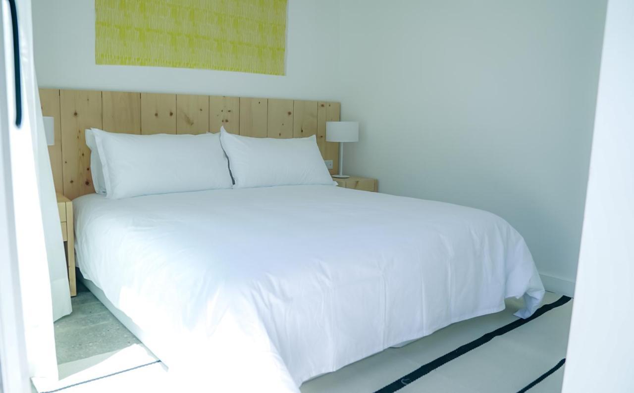 Casagrande Hotel & Beach Club José Ignacio Exteriör bild A bed with a duvet